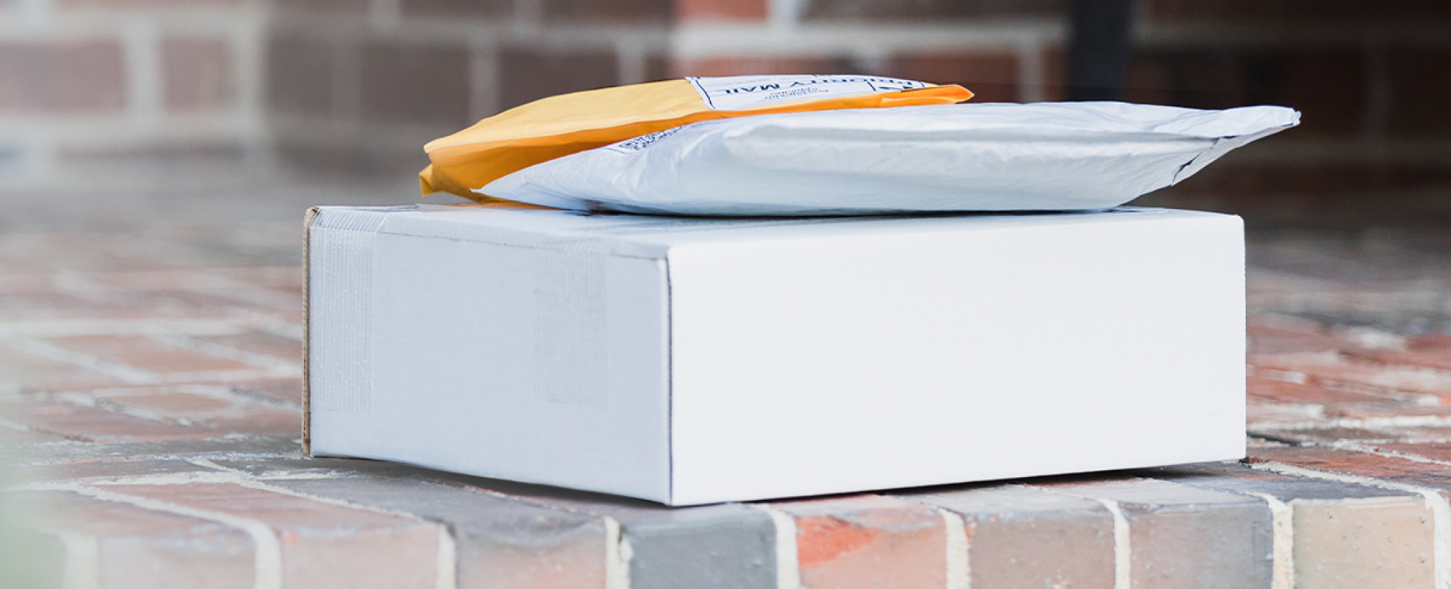 Delivered packages sit on a doorstep.